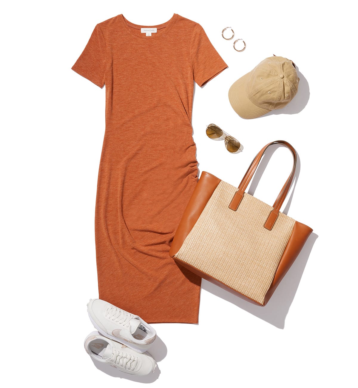 Dark Orange dress with nike shoes, matching handbag, sunglasses, and tan hat all on a white background