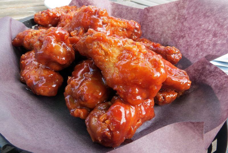 buffalo chicken wings cooked sous vide style sitting in paper basket