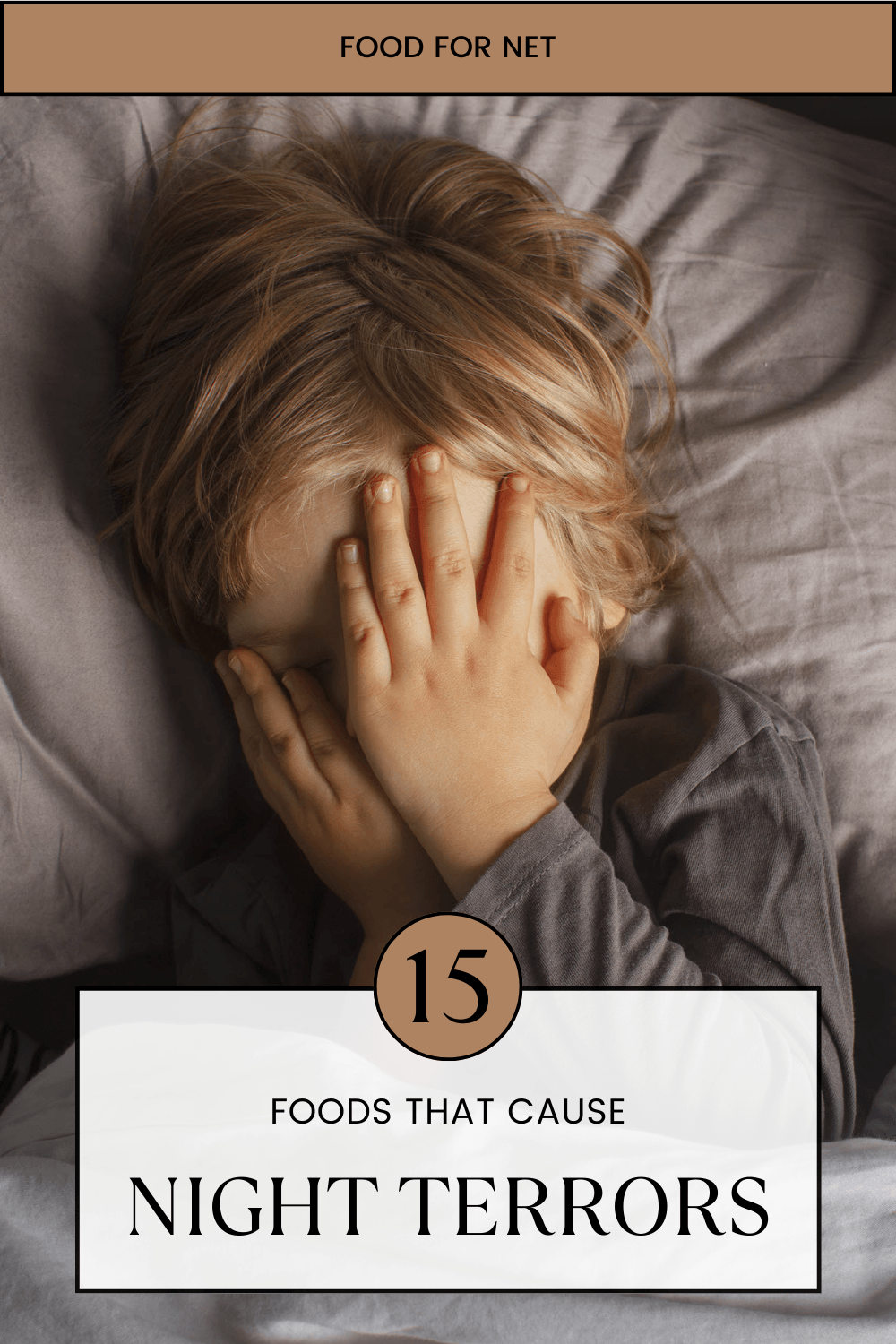 A young child in bed with hands over his or her face, highlighting the idea of foods that cause night terrors