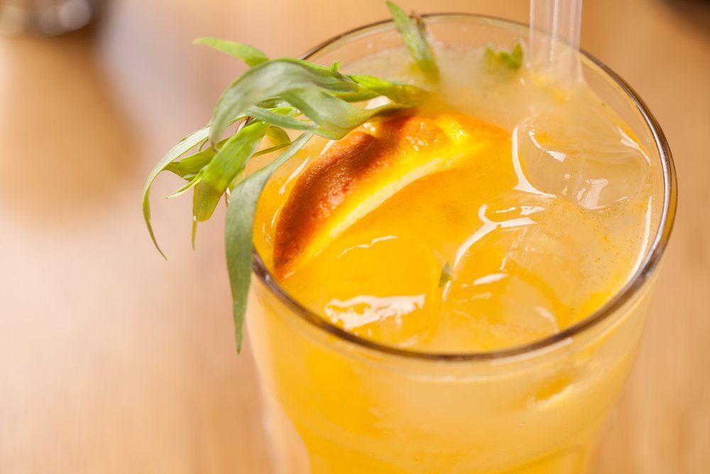 A close up image of a screwdriver cocktail with ice