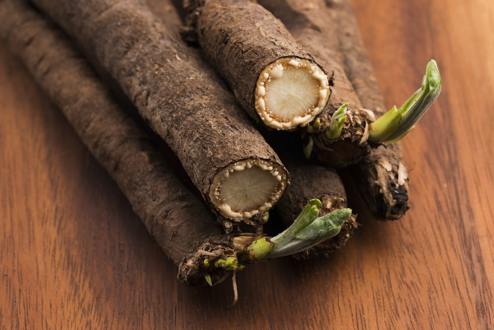 A small collection of salsify roots on a wooden table