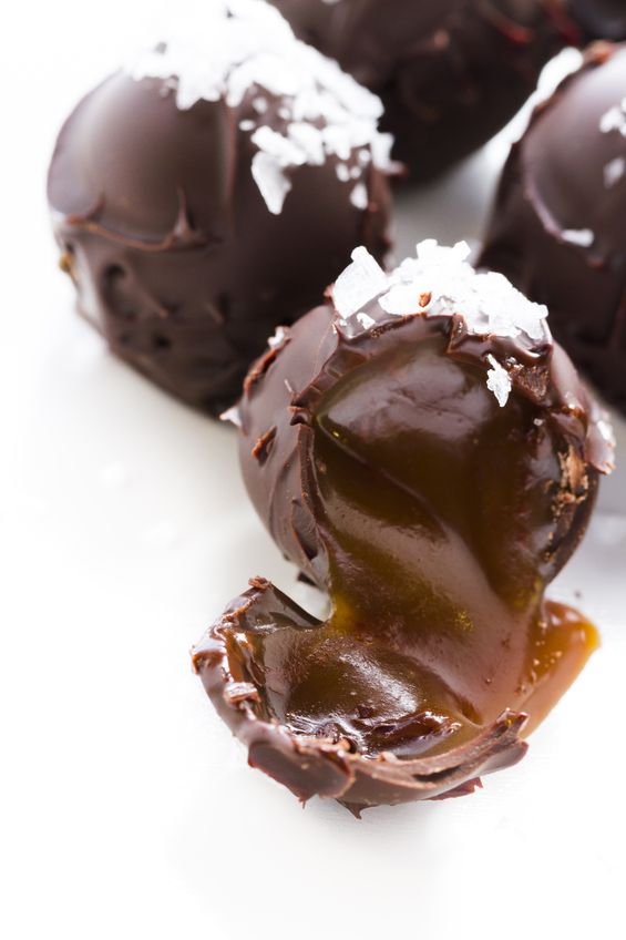 Salted caramel truffles on a white plate