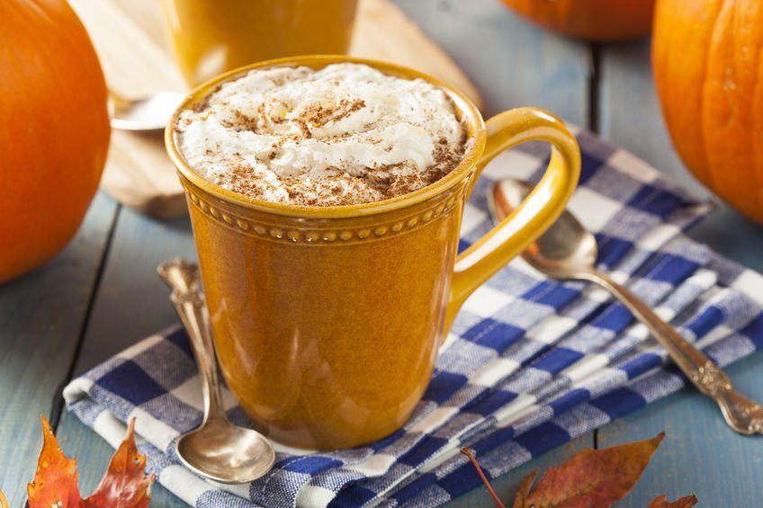 A blue and white tea towel with a pumpkin spice latte