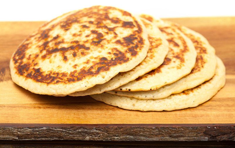 Wheat pancakes on a board