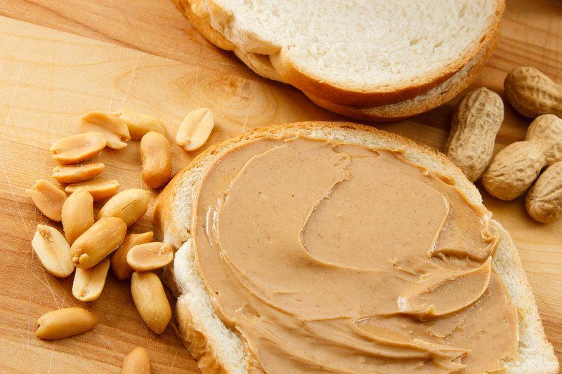 Peanut butter on bread with peanuts