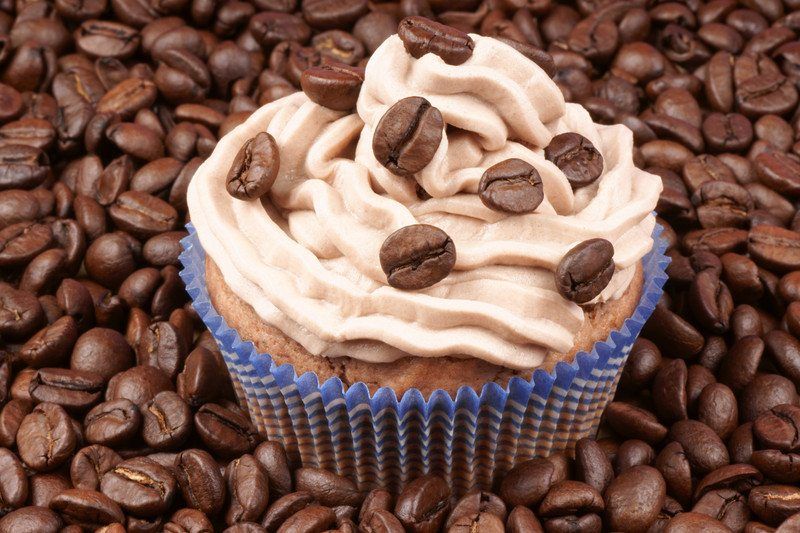 cupcake with whole coffee beans on espresso flavored frosting