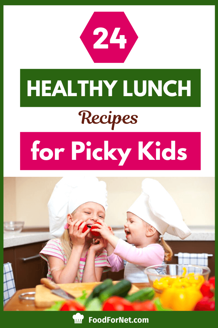 two young girls playing with red peppers and enjoying a healthy lunch