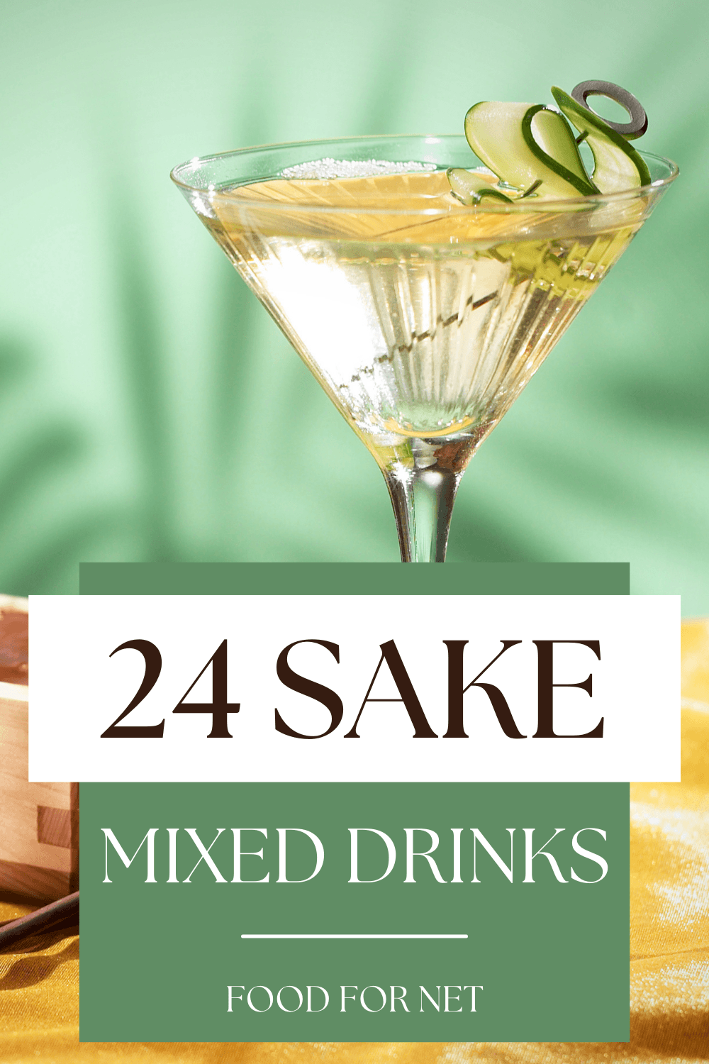 A wooden box next to a sake martini on a table with leaves in the background, highlighting the idea of sake mixed drinks