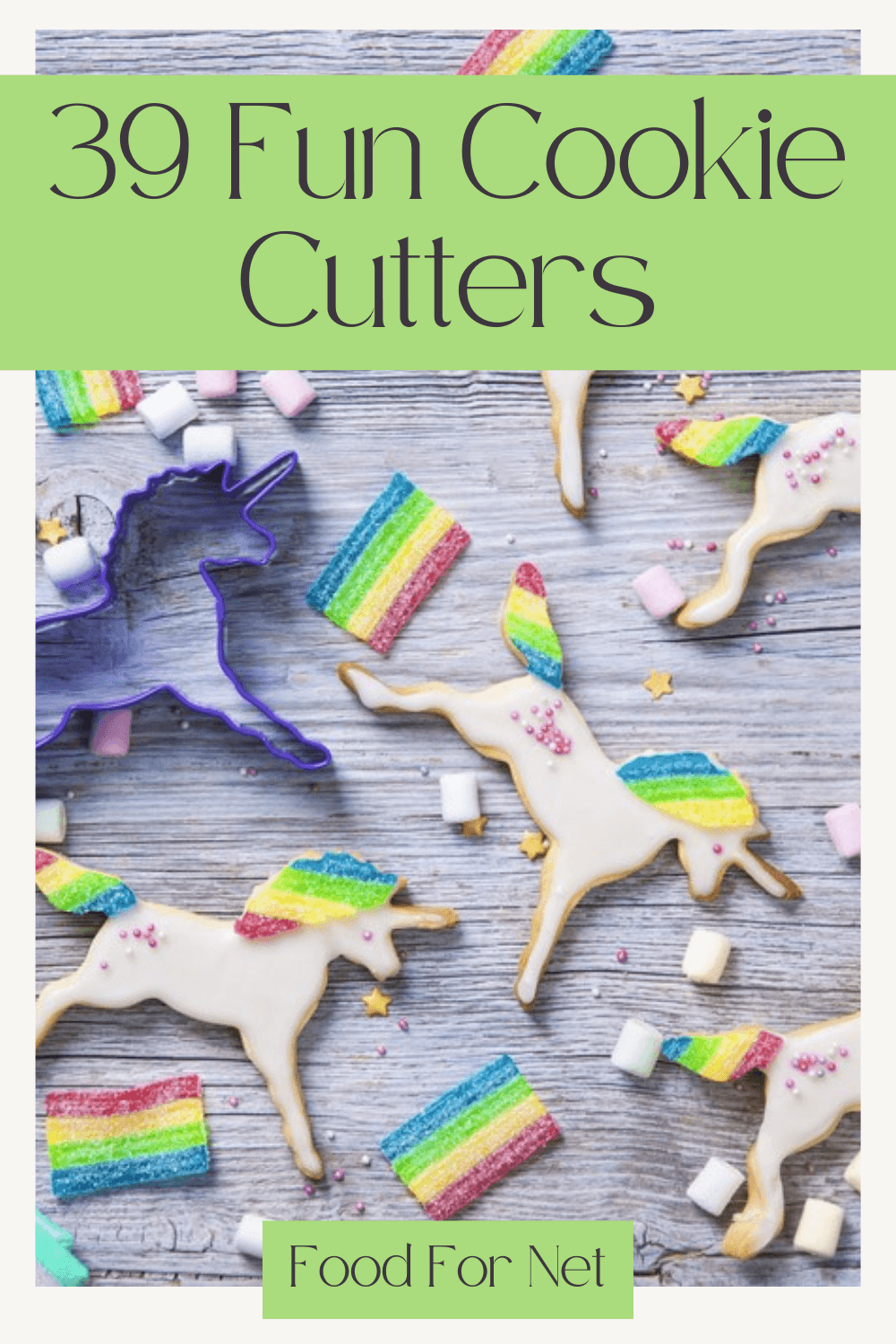 A light colored wooden table with cookie unicorns, a unicorn cookie cutter and rainbows, as an example of fun cookie cutters