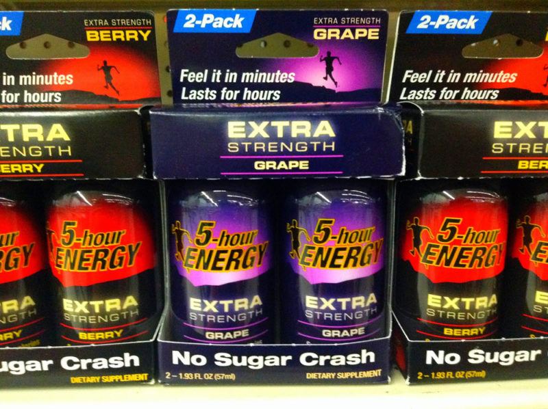 5-Hour Energy Extra Strength 2-packs on a shelf in berry and grape flavors