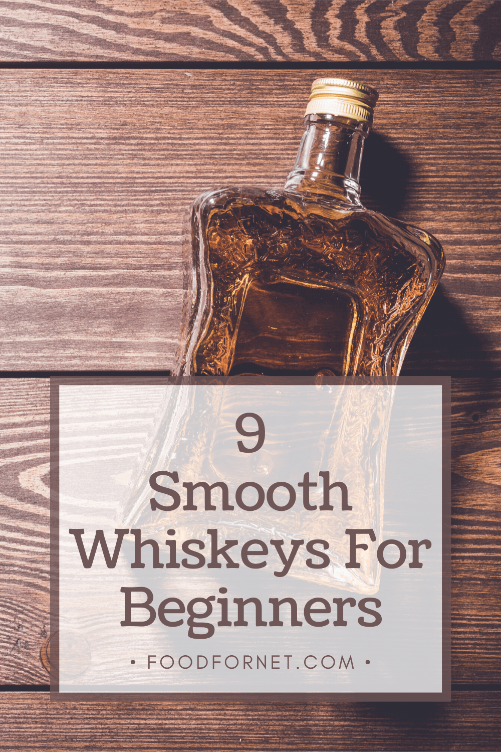 Smooth Whiskeys For Beginners. A bottle of smooth-tasting whiskey on a wooden table.