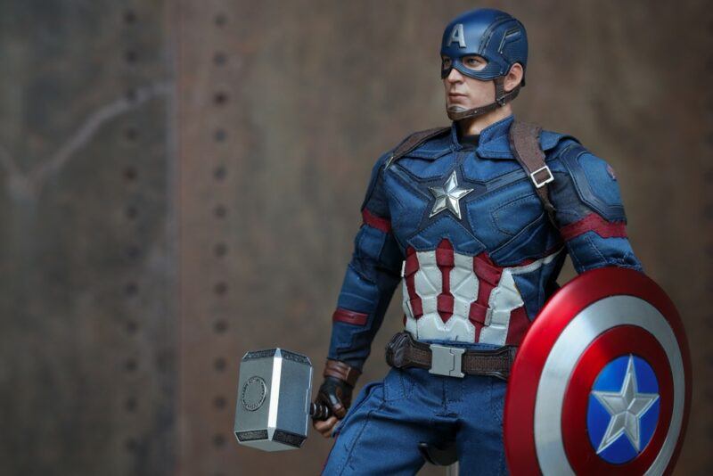 A figurine of Captain America, complete with his shield and Thor's hammer