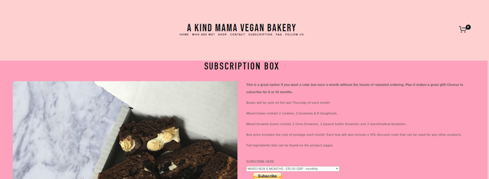 A Kind Mama Bakery website screenshot showing a two-tone pink background, with brownie photos and details about the box. 