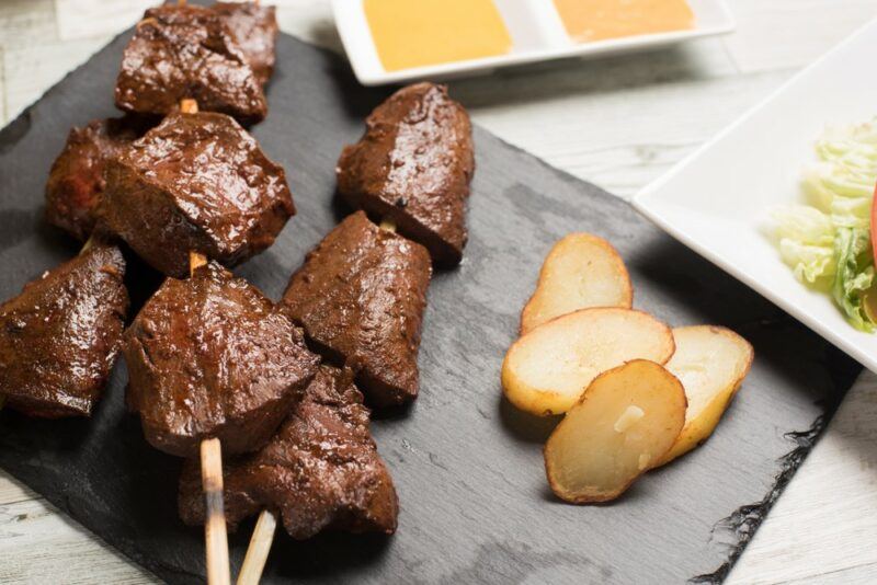 Skewers of cooked heart, called anticuchos de corazon