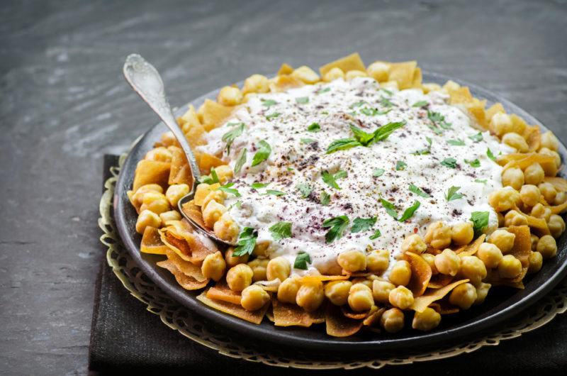 A bowl of fatta with a creamy topping