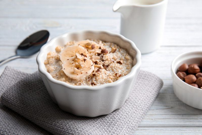 A white bowl with quinoa porridge and