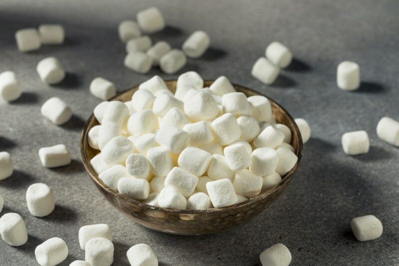 A small bowl filled with tiny mashmallows