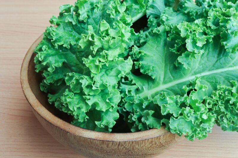 A brown bowl with curly kale