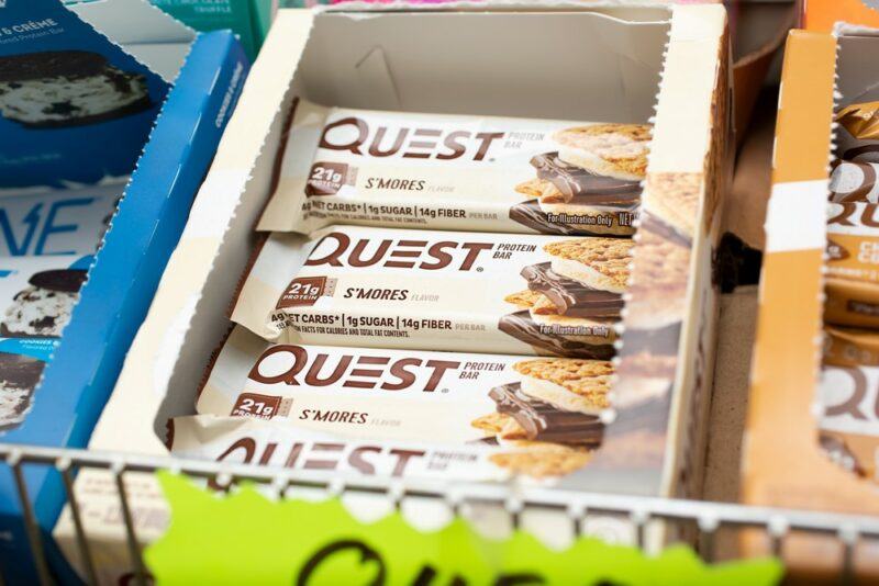 A box of Quest protein bars in a grocery store