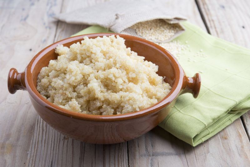 A brown dish of cooked quinoa