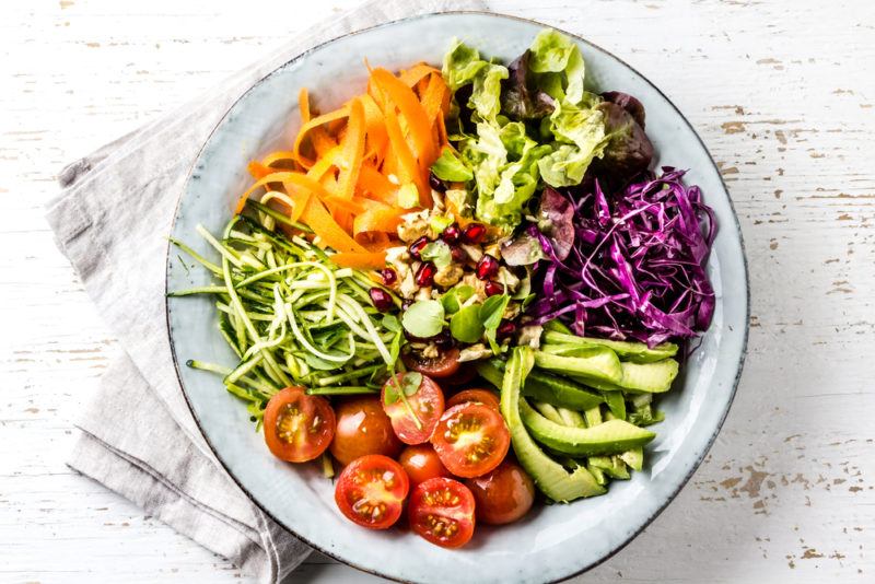 A buddha bowl with a variety of different colors