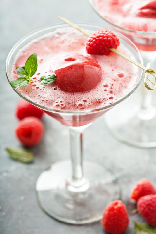 A martini glass with fresh gelato and champagne