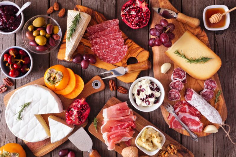 A charcuterie board with cheese and meat