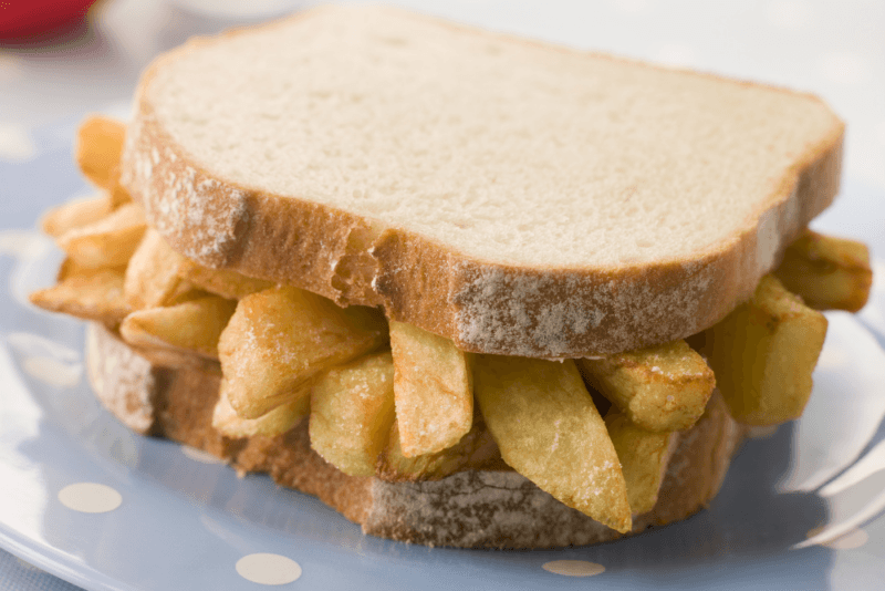 A fresh chip butty made on white bread.