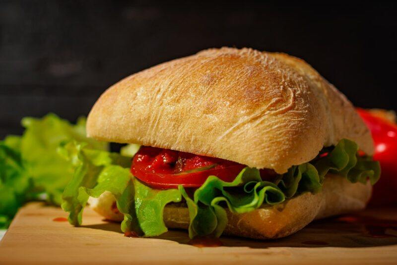 A large ciabatta roll, filled with vegetables