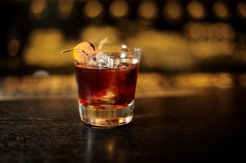 A glass on a bar, containing a ginger rabbit cocktail