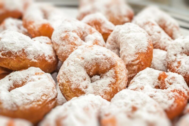 Fresh powdered donuts in a pile