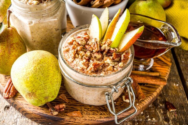 A delicious fall breakfast with overnight oats, pears, and maple syrup