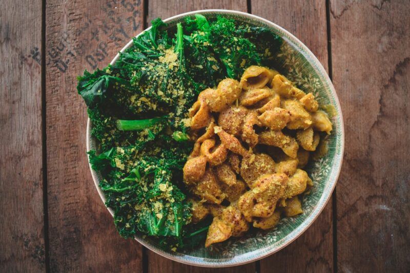 A vegan meal that has been prepared using greens and nutritional yeast