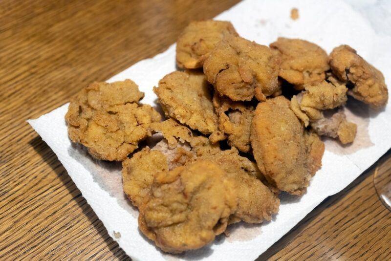 A white plate containing a deceptively named dish of Rocky Mountain oysters