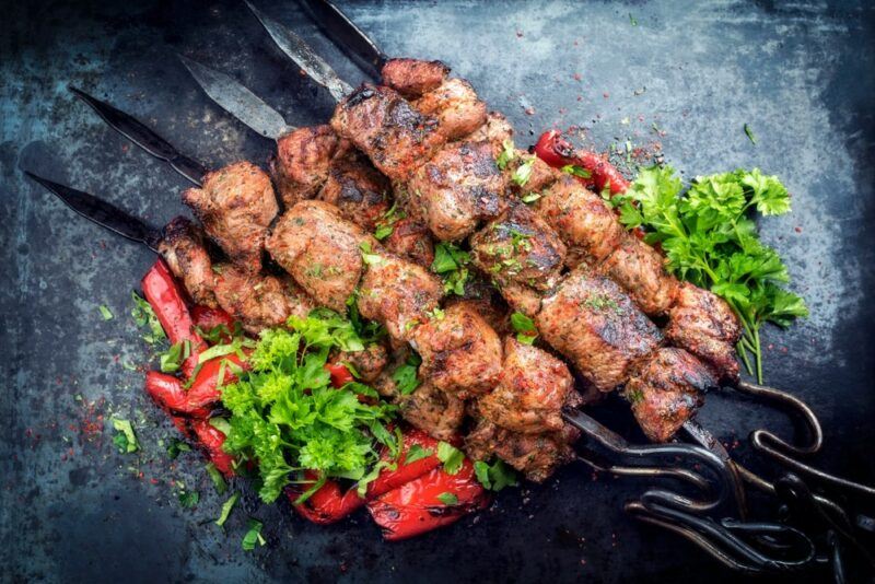 Pieces of meat called anticuchos threaded onto skewers