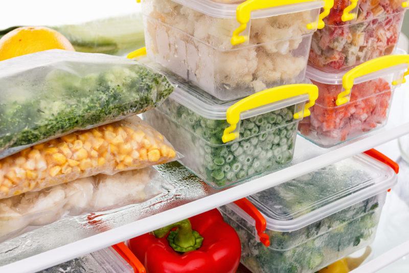 A full freezer with various bags and containers