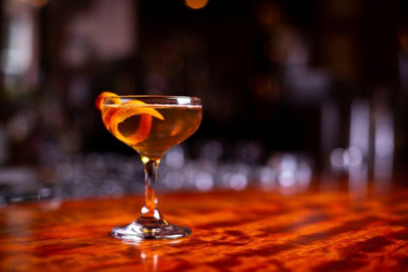 A bourbon sidecar cocktail with a citrus twist on a bar