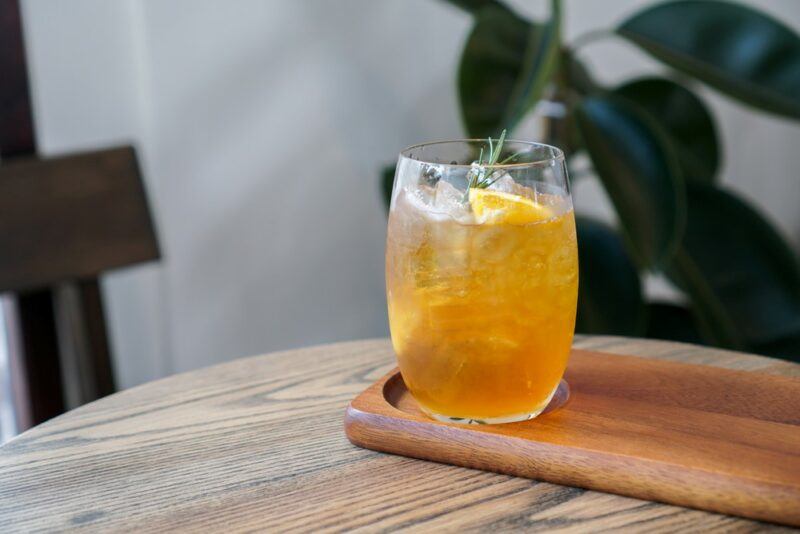 A single glass with a breakfast club cocktail on a table