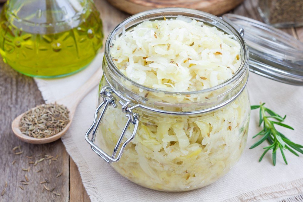 A glass jar filled with sauerkraut