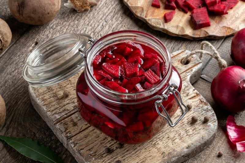 A glass jar filled with pickled beets