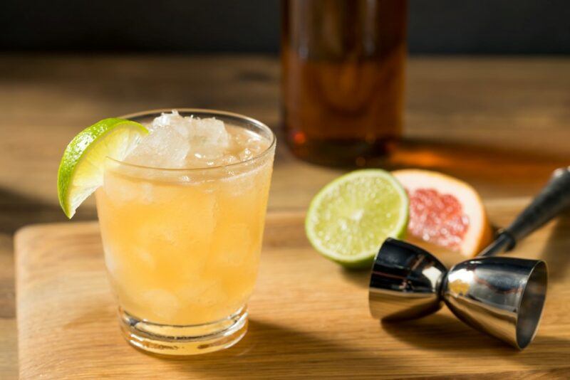 A glass with ice and a navy grog cocktail