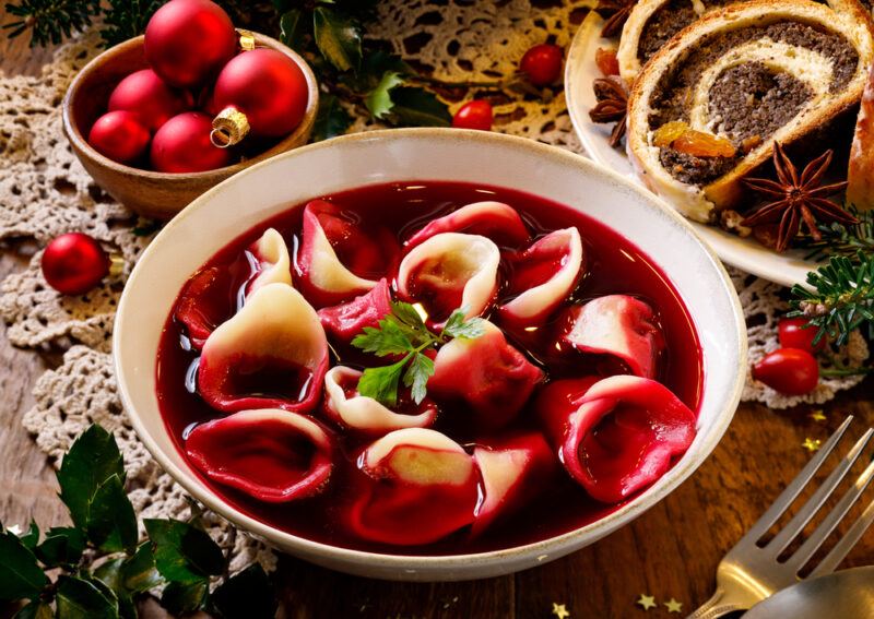 A large bowl with a red beetroot barszcz soup