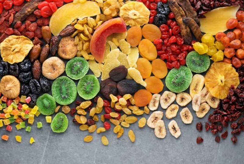 A flat lay of many types of dried fruit, including some obscure types, like dried kiwifruit