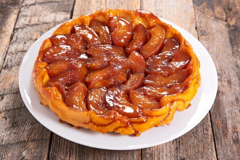 A white plate with a large tarte tatin