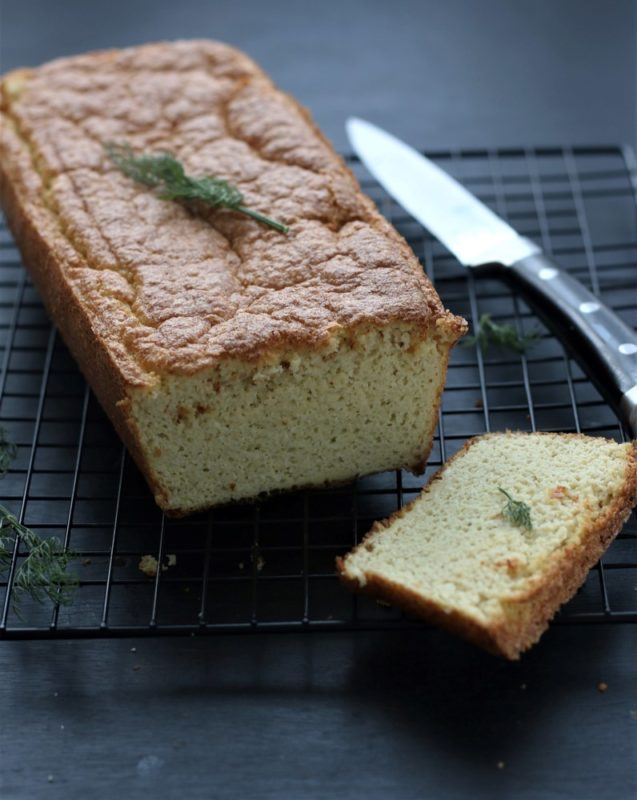 A loaf of cauliflower bread on a wire tray