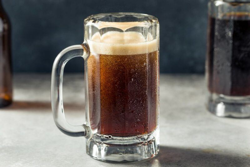 A single mug of root beer on a table