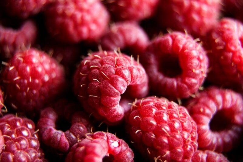 A selection of fresh raspberries in a pile