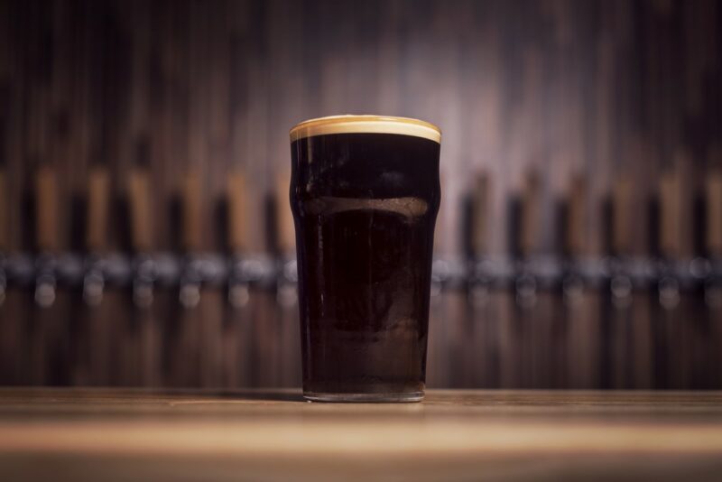 A pint glass containing a graveyard cocktail