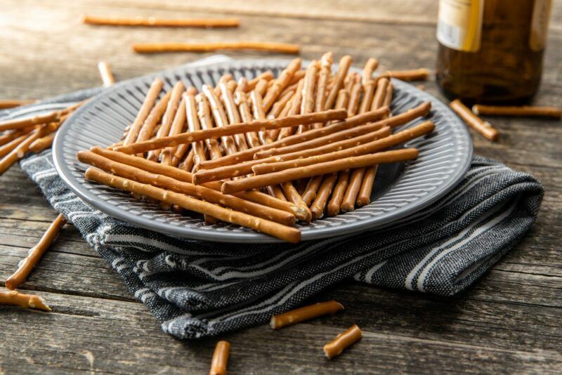 A large gray plate with straight pretzels