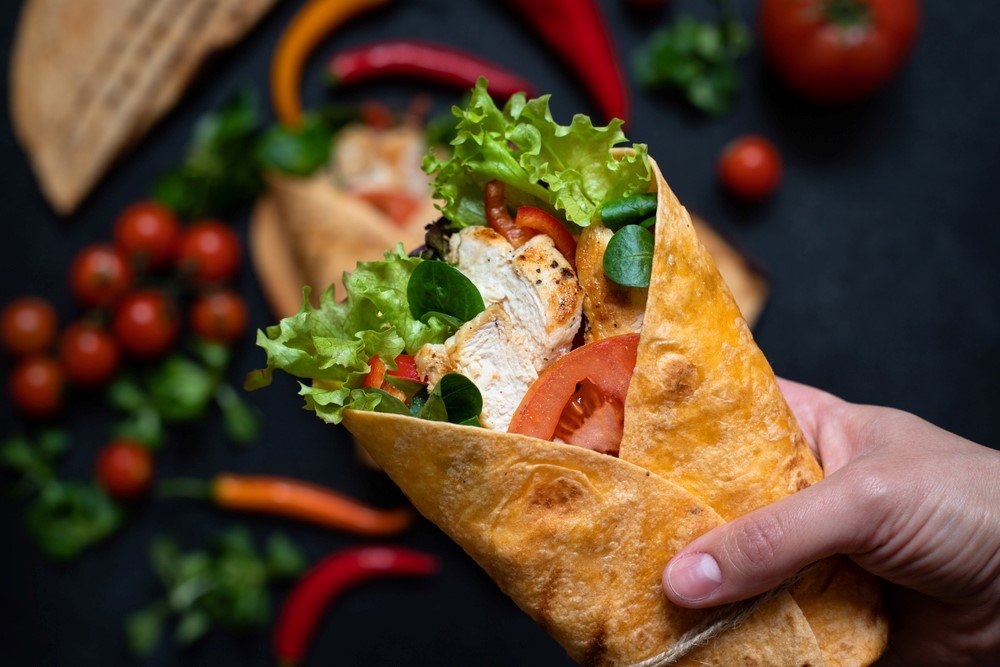 A delicious wrap made with a corn tortilla and salad